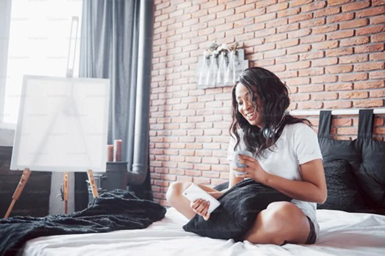 Person holding a smartphone Person holding a smartphone
