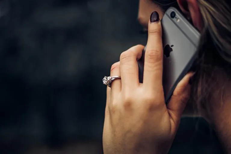 Person holding an iPhone Person holding an iPhone
